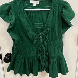 peplum top with zipper and front bow tie